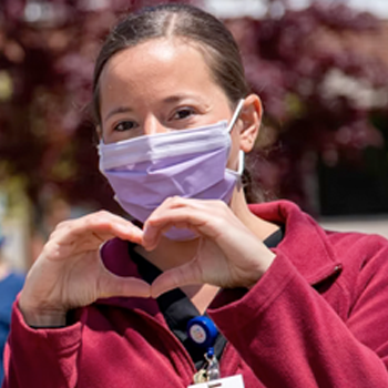 Nurse making a heart with hands